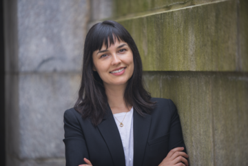 Headshot of Jeannette Garcia Coppersmith standing in Radcliffe Yard at Harvard University